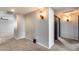 Carpeted hallway with access to bedrooms and view of the landing at 23420 N 121St Ave, Sun City, AZ 85373