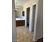 Bathroom features a vanity with a sink and a door to the walk-in closet at 25766 W Valley View Dr, Buckeye, AZ 85326