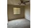 Bedroom with carpeted floors, a ceiling fan, and a window, offering a cozy space at 25766 W Valley View Dr, Buckeye, AZ 85326