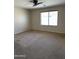 Bedroom featuring neutral walls, carpet, a ceiling fan, and a window at 25766 W Valley View Dr, Buckeye, AZ 85326
