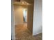 Hallway featuring tile floors and neutral colored walls at 25766 W Valley View Dr, Buckeye, AZ 85326