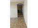 Hallway featuring tile flooring and an arched doorway, leading to other areas of the house at 25766 W Valley View Dr, Buckeye, AZ 85326