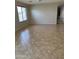 Empty room featuring tile floors and natural light, perfect for customization and decor at 25766 W Valley View Dr, Buckeye, AZ 85326