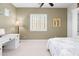 Bedroom with a white desk, built-in shelving and a window with shutters at 27020 N 14Th Ln, Phoenix, AZ 85085