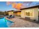 Gorgeous pool with stone features, relaxing lounge chairs, and covered patio perfect for outdoor entertaining at 27020 N 14Th Ln, Phoenix, AZ 85085