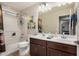 Well-lit bathroom with double sink vanity, and shower/tub combo at 291 N Scott Dr, Chandler, AZ 85225