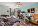 Bedroom features laminate wood floors and modern ceiling fan at 291 N Scott Dr, Chandler, AZ 85225