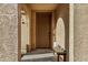 View of door and entryway to tan home. Bench with candles on the right at 291 N Scott Dr, Chandler, AZ 85225