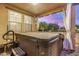Large hot tub situated on covered back patio at 291 N Scott Dr, Chandler, AZ 85225