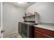 Modern laundry room equipped with newer washer and dryer at 291 N Scott Dr, Chandler, AZ 85225