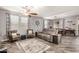 Bright and spacious living room features wood-look floors, stylish furnishings, and multiple windows at 291 N Scott Dr, Chandler, AZ 85225