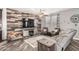 Cozy living room with wood-look floors, accent wall, ceiling fan and comfortable seating area at 291 N Scott Dr, Chandler, AZ 85225