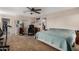 Main bedroom featuring carpet flooring, fan, and mirror at 291 N Scott Dr, Chandler, AZ 85225
