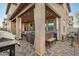 Beautiful covered patio features a hot tub, BBQ grill, ceiling fan, privacy curtains and ample seating at 291 N Scott Dr, Chandler, AZ 85225