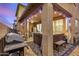 This covered patio features a barbecue, a hot tub and a seating area adjacent to the kitchen at 291 N Scott Dr, Chandler, AZ 85225