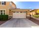 Spacious three-car garage with ample parking and stone veneer accents on the home's exterior at 3192 N Park St, Buckeye, AZ 85396