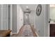 Upstairs hallway with wood floors, white trim, and decorative wall accents at 3192 N Park St, Buckeye, AZ 85396