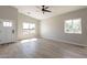 This primary bedroom features wood-look flooring and lots of natural light at 3240 W Desierto Dr, Eloy, AZ 85131