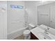 Clean bathroom with a shower-tub combo, toilet, and vanity with a sink at 3316 W Hayduk Rd, Laveen, AZ 85339