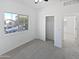 Well-lit bedroom showcasing a window, closet, and neutral carpet for a cozy feel at 3316 W Hayduk Rd, Laveen, AZ 85339