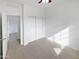 Bedroom featuring neutral carpet and a sliding-door closet at 3316 W Hayduk Rd, Laveen, AZ 85339