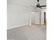 Spacious bedroom featuring neutral carpet, a ceiling fan, and access to an ensuite bathroom at 3316 W Hayduk Rd, Laveen, AZ 85339