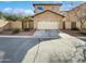 Two-story home featuring a two car garage, desert landscaping and block wall privacy fence at 3316 W Hayduk Rd, Laveen, AZ 85339