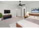 Serene main bedroom with a ceiling fan, neutral tones, and stylish furniture at 3316 W Hayduk Rd, Laveen, AZ 85339