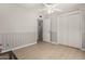 Bright bedroom featuring light-colored walls, wood floors, a ceiling fan, and a closet at 3324 W Pershing Ave, Phoenix, AZ 85029