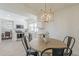 Cozy dining area open to an updated kitchen with stainless appliances and white cabinetry at 3369 W Sandra Ter, Phoenix, AZ 85053