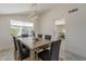 Bright dining room with vaulted ceilings, gray upholstered chairs, and modern chandelier lighting fixture at 3369 W Sandra Ter, Phoenix, AZ 85053