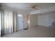 Bright living room featuring tiled floors and a ceiling fan at 3640 W Garfield St, Phoenix, AZ 85009