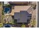 An aerial view of the backyard with its refreshing pool, stylish pergola, and ample space for entertaining at 3859 E Wood Dr, Chandler, AZ 85249