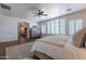 Serene bedroom features plantation shutters, hardwood floors, and an en-suite bathroom at 3859 E Wood Dr, Chandler, AZ 85249