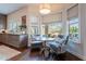 Cozy breakfast nook with plush seating, natural light, and serene views of the outdoor landscape at 3859 E Wood Dr, Chandler, AZ 85249
