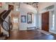 Gracious foyer with a curved staircase, hardwood floors, and high ceilings for a grand entrance at 3859 E Wood Dr, Chandler, AZ 85249
