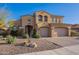 Stunning Southwestern home featuring a two-car garage, beautiful desert landscaping, and a neutral color palette at 3859 E Wood Dr, Chandler, AZ 85249