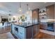 Expansive kitchen showcases a large island, stainless appliances, custom cabinetry, and open layout at 3859 E Wood Dr, Chandler, AZ 85249