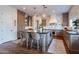 Stylish kitchen features an island with seating, stainless steel appliances, and custom cabinetry at 3859 E Wood Dr, Chandler, AZ 85249