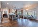 Well-appointed kitchen featuring a large island, hardwood floors, and a breakfast nook by a window at 3859 E Wood Dr, Chandler, AZ 85249