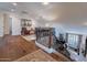 Open loft area featuring wood floors, comfortable seating, and natural light from a large window at 3859 E Wood Dr, Chandler, AZ 85249