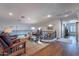Spacious loft area with hardwood floors, a work desk, and comfortable seating near iron railing at 3859 E Wood Dr, Chandler, AZ 85249