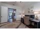 Comfortable office space with double doors, neutral walls, a large desk, and natural light at 3859 E Wood Dr, Chandler, AZ 85249