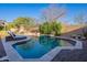 Tranquil pool featuring cool, clear water and rock features, perfect for relaxation at 3859 E Wood Dr, Chandler, AZ 85249