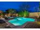 Sparkling pool with blue-green water surrounded by desert landscaping, perfect for relaxation at 3859 E Wood Dr, Chandler, AZ 85249