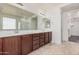 Bathroom with dual sinks, vanity, tile floor, and large mirror offers lots of space at 3938 E Morrison Ranch Pkwy, Gilbert, AZ 85296