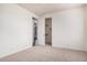 Bedroom featuring neutral carpet and an open doorway to an ample closet space at 3938 E Morrison Ranch Pkwy, Gilbert, AZ 85296
