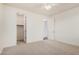 Bedroom featuring neutral carpet, a ceiling fan and a walk-in closet for ample storage at 3938 E Morrison Ranch Pkwy, Gilbert, AZ 85296