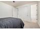 Bedroom with double door closet, ensuite bathroom, and carpet at 3938 E Morrison Ranch Pkwy, Gilbert, AZ 85296