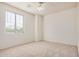 Bedroom featuring neutral carpet, corner windows and a ceiling fan at 3938 E Morrison Ranch Pkwy, Gilbert, AZ 85296